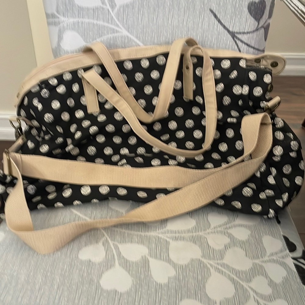 Large tote by Mossimo . Black and tan. Handles and also adjustable straps.